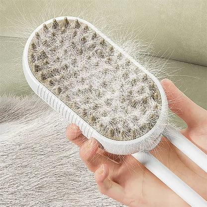 White grooming brush with pet hair collected on it, held by a hand against a neutral background.