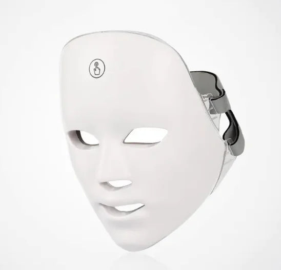 White LED face mask on a light gray background