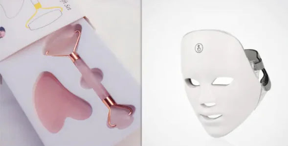Skincare tools including a pink roller and white LED face mask on a light background