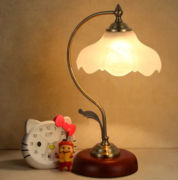 Vintage-style table lamp with a warm glow on a beige background