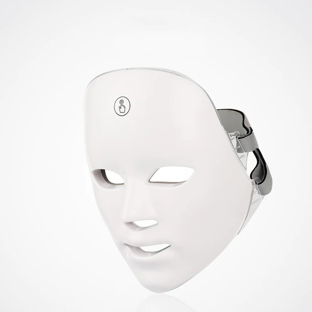 White LED face mask on a light gray background