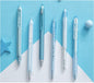 Set of six pens on a blue and white geometric background