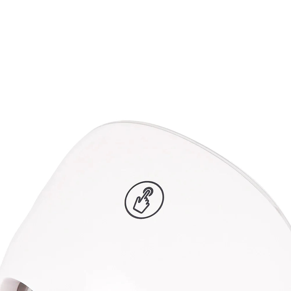 Close-up of a white electronic device with a circular logo on a white background