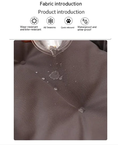 Fabric with water droplets being poured onto it, showcasing water-resistant properties.
