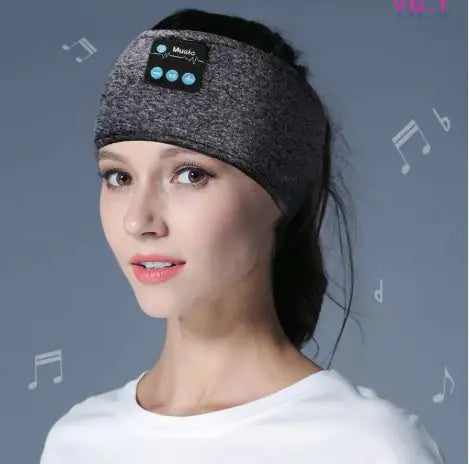 Woman wearing a gray Bluetooth headband with music icon on a gray background